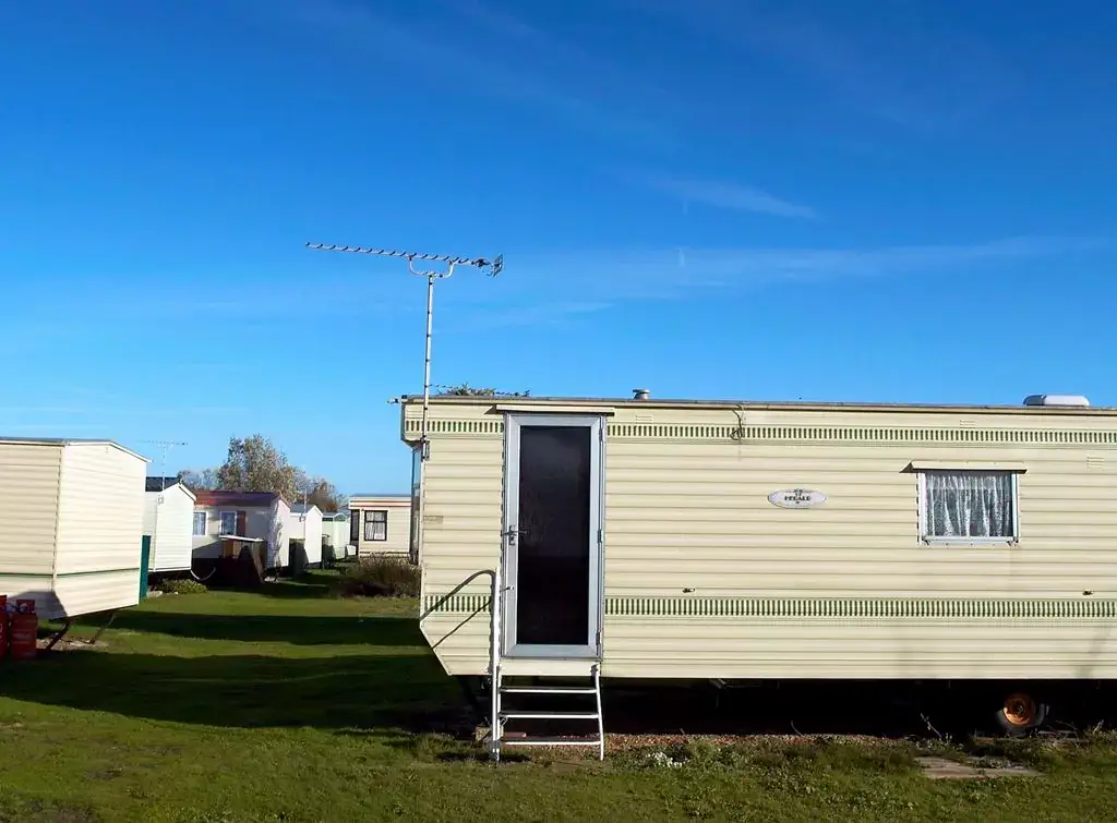 A trailer house with Mobile Home Data Plate